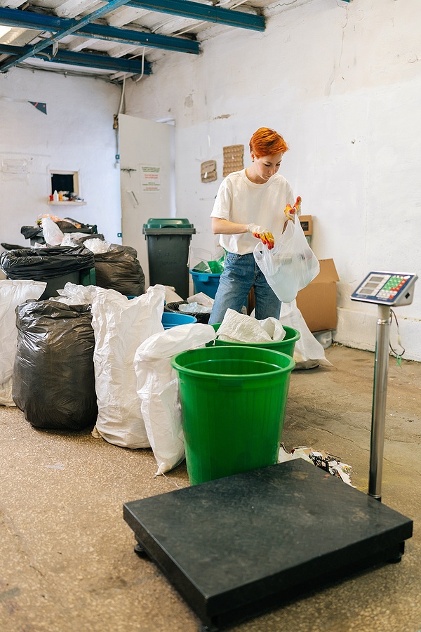 A person separating recycling